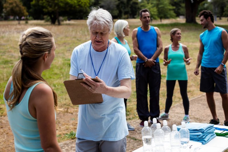 Volunteer registering athletes name for race